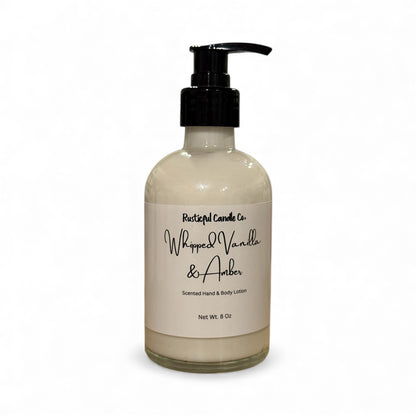 Hand and body lotion bottle labeled 'Whipped Vanilla & Amber' on a white background
