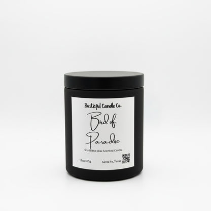 Rusticful Candle Co Bird of Paradise scented soy blend candle in a matte black jar with a matching lid.