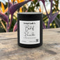 Rusticful Candle Co Bird of Paradise scented soy blend candle in a matte black jar on a wooden surface.